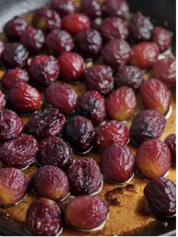 These roasted grapes are beautifully caramelized, with wrinkled skins and a glossy finish, perfect for adding a burst of sweetness to savory dishes